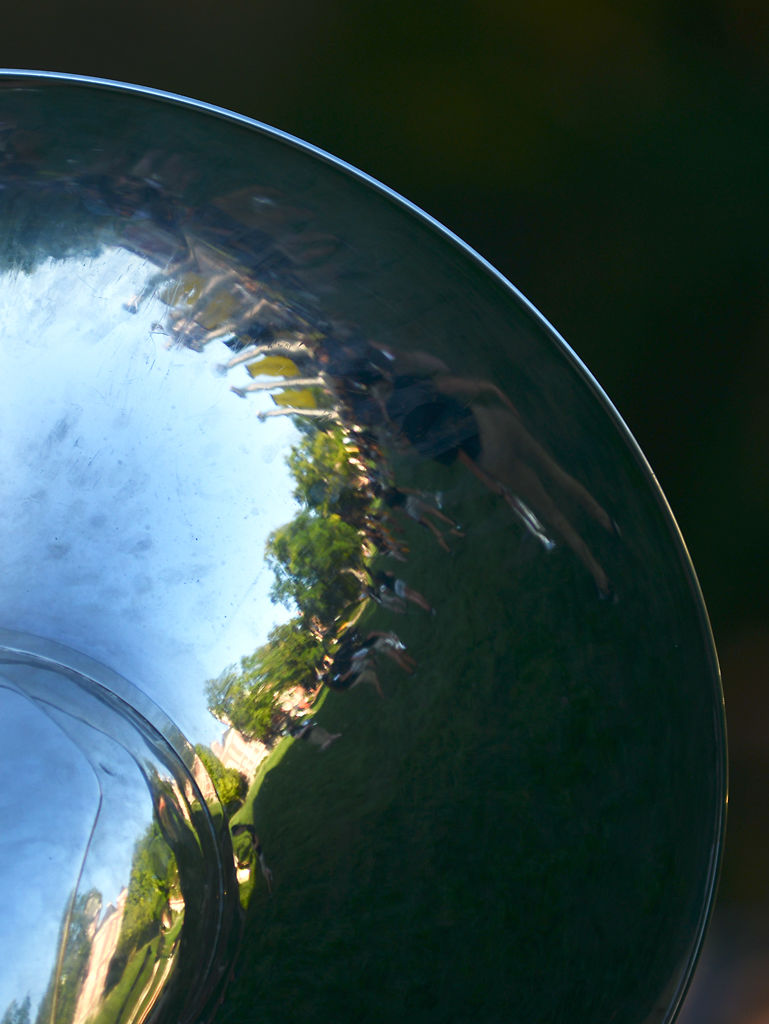 A reflection of the columns shines in the bell of a tuba during the "Concert on the Quad"